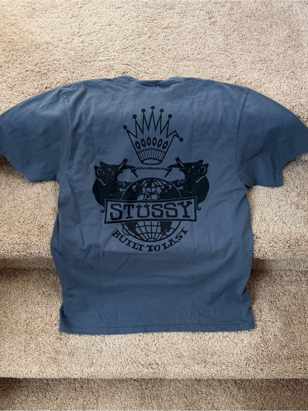 Stussy Blue Short-Sleeve Graphic Tee with Black Crest